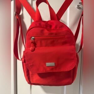 E.T.A.Brand in bright Red is best travel or everyday purse-sized backpack ever!